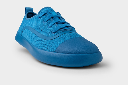 Blue sneaker on a light gray background