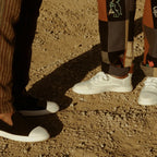 Friends standing in Juntos White Lace-up and Black Slip-on