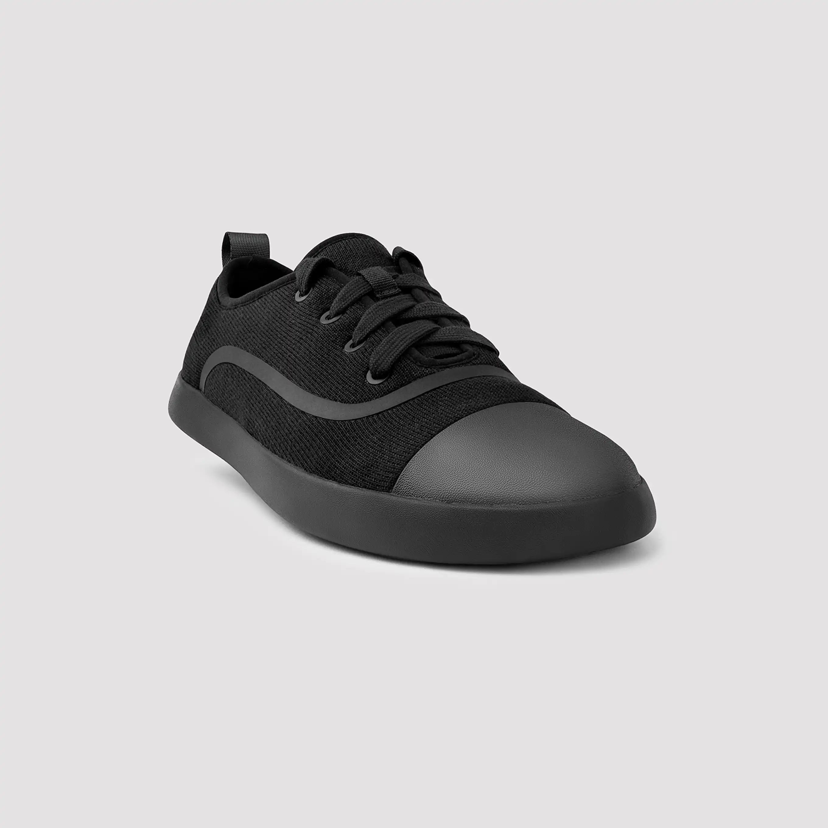 Black sneaker on a light gray background