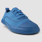 Blue sneaker on a light gray background