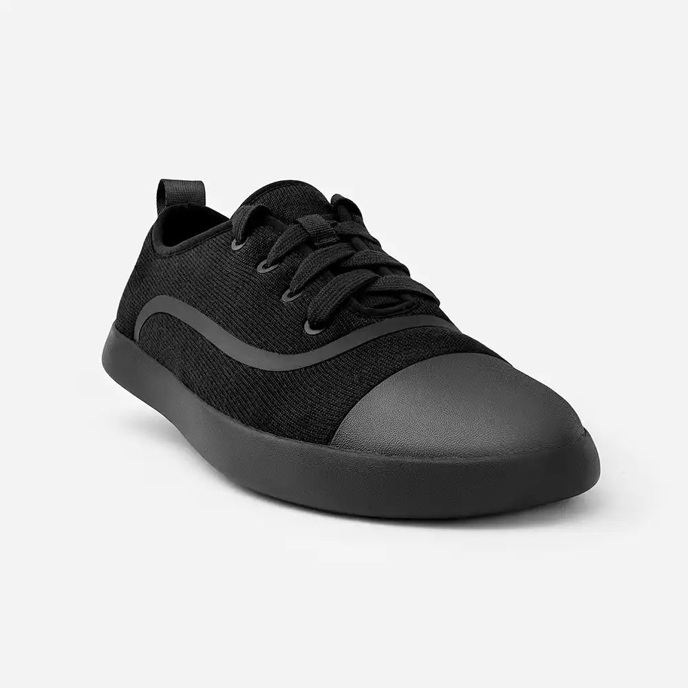 Black sneaker on a light gray background
