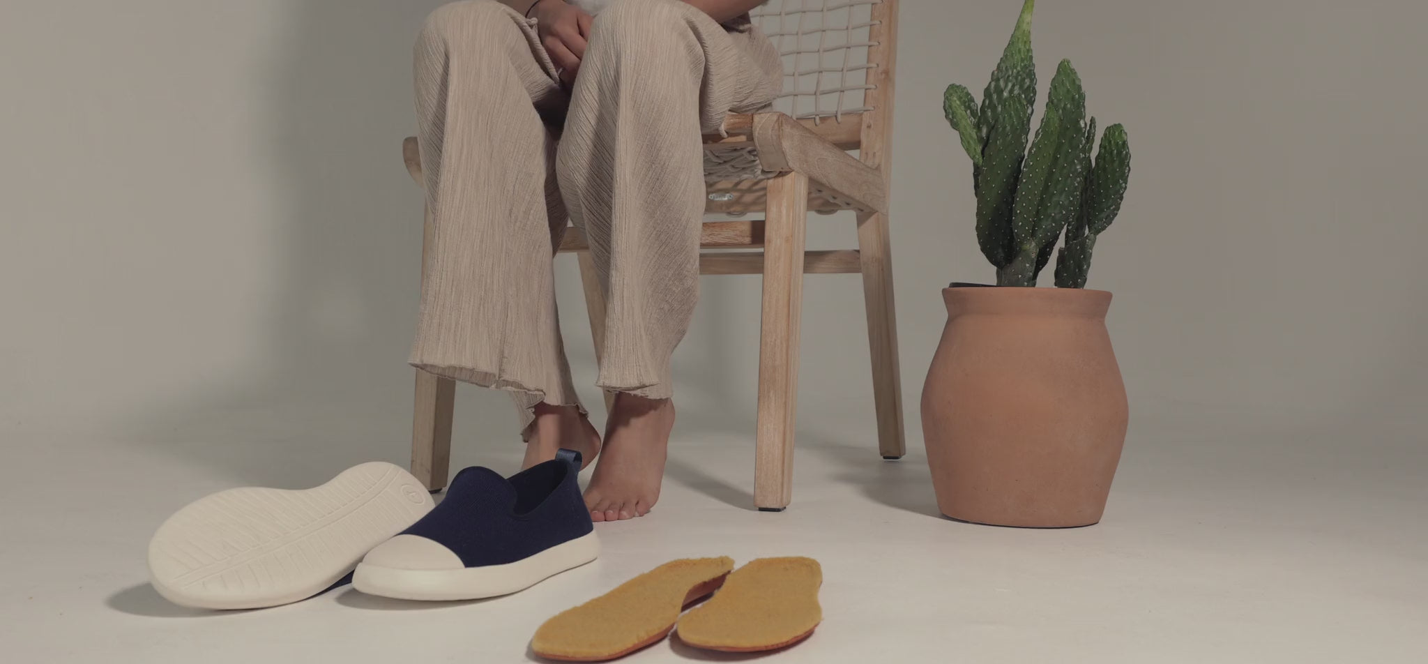 Women wearing AlpaKnit Slip-On sitting on the chair