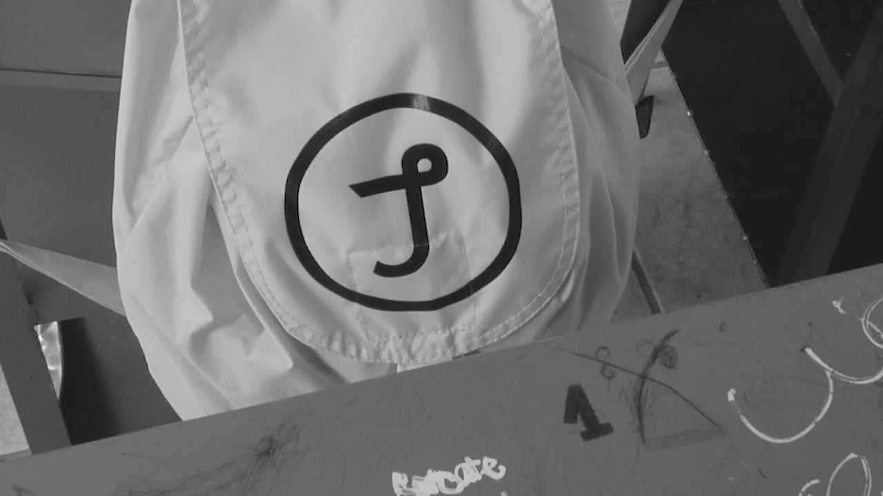 Students holding Juntos bags received as gifts in a video